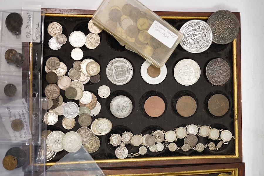 A collection of silver coins mounted as jewellery, pierced coins, commemorative medals, tokens and various coin wallets and sovereign scales